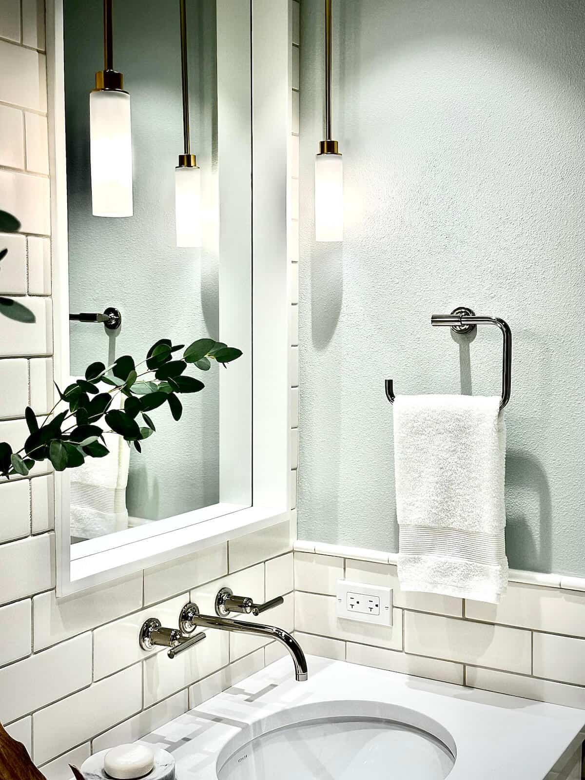 bathroom vanity with lighting and tile