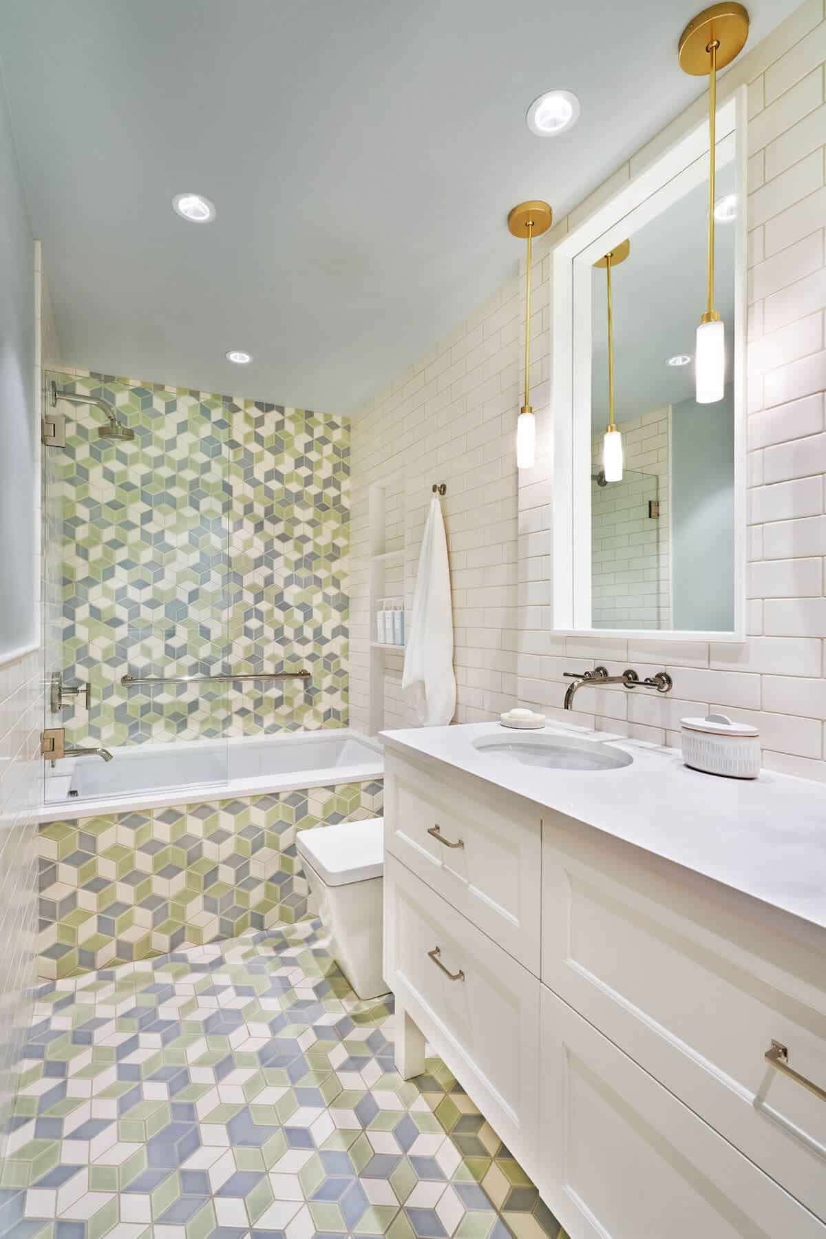 custom green and white tile work in bathroom