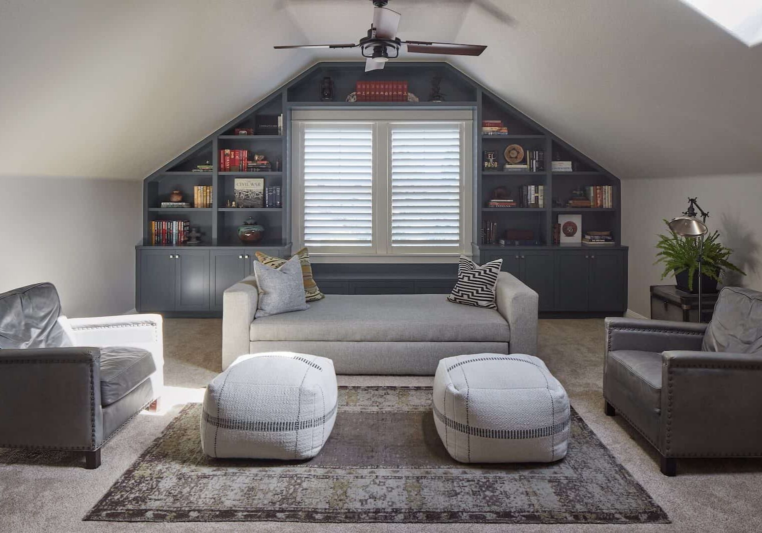 Bonus room with built in book cases, carpet and furniture