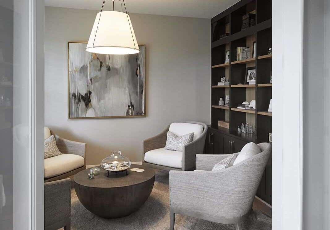 office area with build in book shelve and double door entry