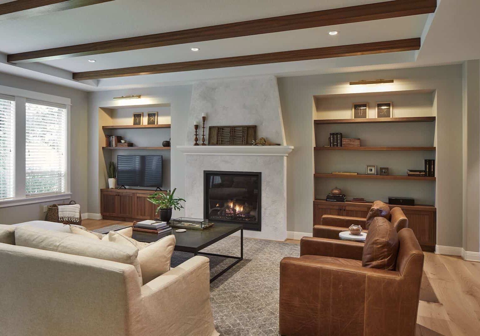 living area with build in fireplace, book shelfs.